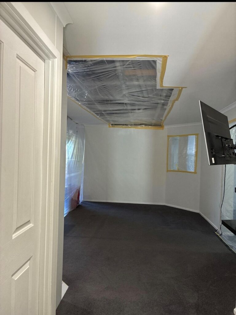 Ceiling cut-out, window and vents sealed with poly and tape ready for post-remediation verification