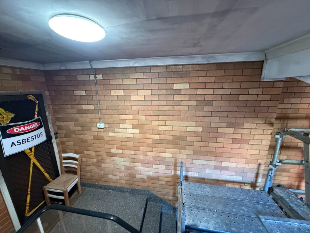 Face brick restored to its original colour after soot removal with dry ice blasting