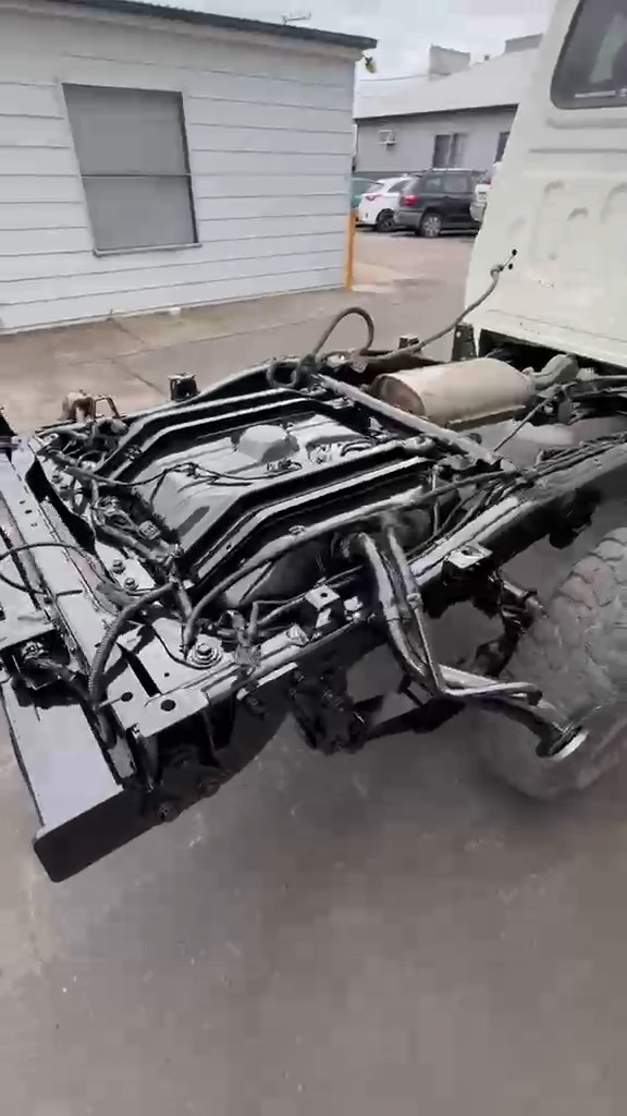 Gloss black cross members and chassis on an ex-mine LandCruiser after rust treatment and IGL coating