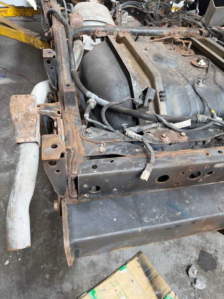 Rusty, mud-caked chassis on an ex-mine Toyota LandCruiser 70 Series before dry ice blasting