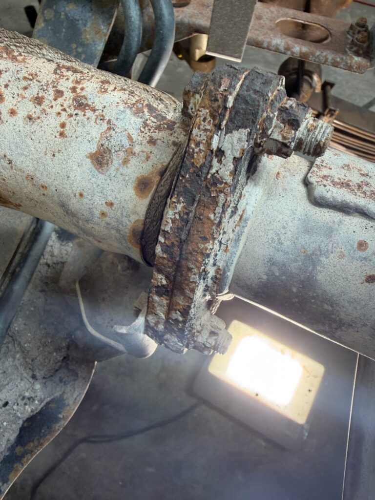 Surface rust and scale on the chassis rail of an ex-mine LandCruiser ute